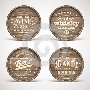 Wooden casks with alcohol drinks emblems photo
