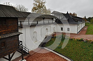 An old wooden fortress with high walls and a water ditch