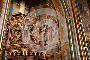 Wooden cathedra of church photo