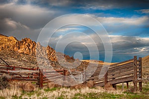 Wooden cattle loading ramp sits on the shady side of the hills