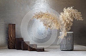 A ladder of wooden catwalks and pampas grass in a vase