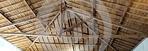 wooden ceiling architecture in big saloon with beams