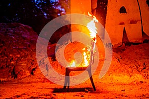 Wooden chair is on fire. Incineration of furniture. Conceptual p