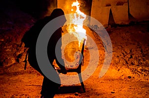 Wooden chair is on fire. Incineration of furniture. Conceptual p photo