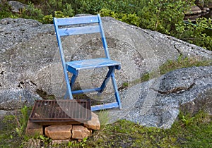 Wooden chair and grill area