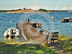Wooden chair and jetty on Sandhamn Island in the Stockholm Archipelago photo