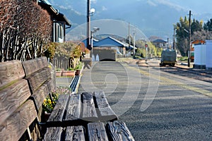 Wooden chair by the railways in the countryside.