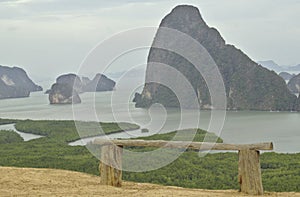 Wooden chair on the sea view point Ao has large and small islands, high mountains, Thailand, Phang Nga Bay