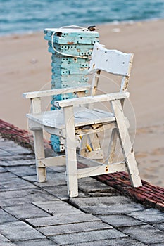Wooden chair, white at the beach