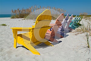 Wooden chairs on beach