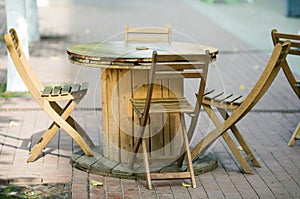 Wooden chairs close-up in a street cafe