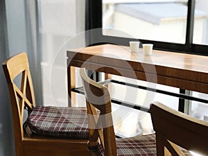 Wooden chairs and table in a cafe. Selective focus.