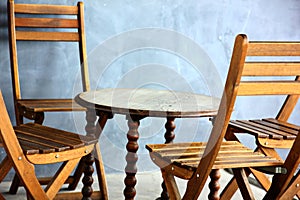 wooden chairs table retro style decoration in the corner . close up old hand craft furniture imitated design in home