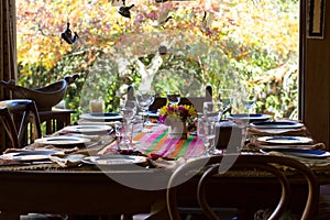 Wooden chairs and table set for family reunion meal photo