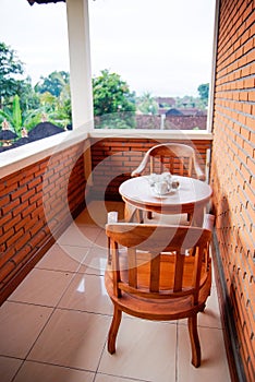 Wooden chairs and table on terrace