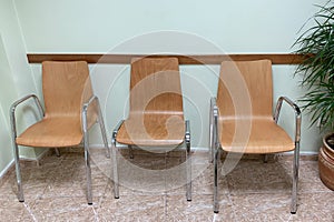 Wooden chairs in the waiting room