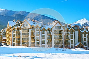 Houses and snow mountains panorama in Bansko, Bulgaria