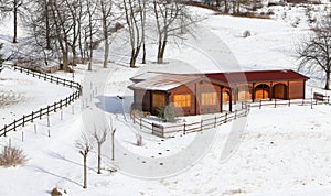 Wooden chalet in the mountains and snowy