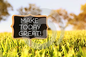 Wooden chalkboard sign with quote: MAKE TODAY GREAT