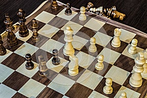 Wooden chess Board and chess pieces in in the game