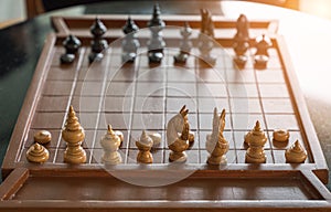 Wooden chess board game with chess pieces ready to play