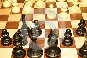 Wooden chess board under white chessmen for game background
