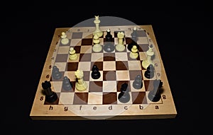 Wooden chess board under white pawns for strategy concept