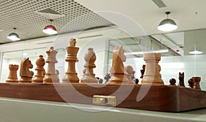 Wooden chess piece on chess board ready to play.