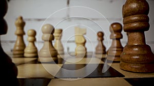 wooden chess pieces on chessboard