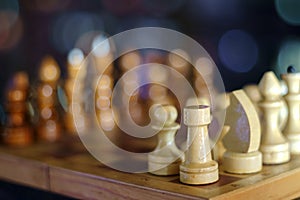 Wooden chess pieces on the chessboard