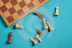 Wooden chess pieces and a chessboard