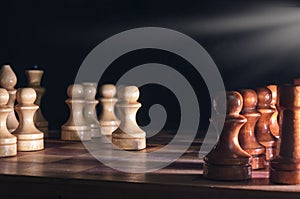 Wooden chess pieces and a chessboard