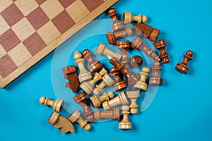 Wooden chess pieces and a chessboard