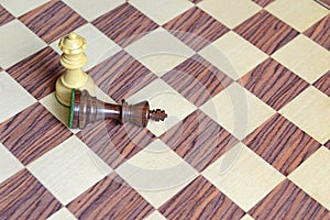 Wooden Chess pieces on Chessboard