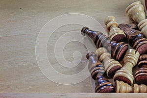 Wooden chess pieces wooden background.