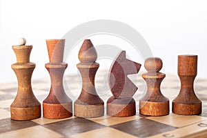 Wooden Chess pieces on wooden board for play