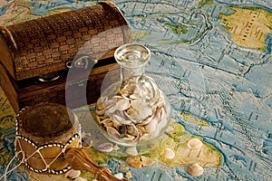 Wooden chest with jug and sea shells