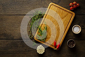Wooden chopping board. Food seasoning background, Spices, herbs. Recipe, mock up