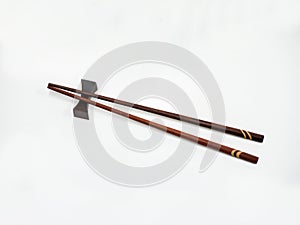 Wooden chopsticks on bar.