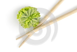 Wooden chopsticks and wasabi isolated photo