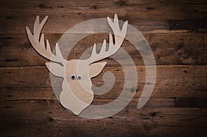 Wooden christmas background with antlers or reindeer decoration.