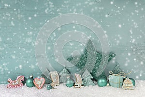 Wooden christmas background mint green with snow.