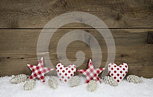 Wooden christmas background with red white checked hearts and st