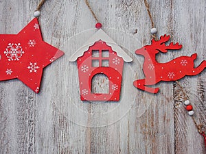 Wooden christmas decoration -over wooden background christmas house and star photo