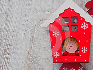 Wooden christmas decoration -over wooden background christmas house and star photo