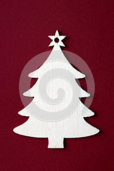 Wooden Christmas decoration on red background