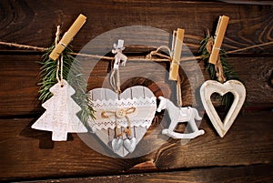 Wooden christmas decorations hanging on twine