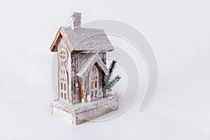 A wooden christmas house with warm light inside. Christmas wooden eco decor. Santa`s house with diodes
