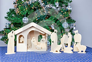 Wooden christmas stable with religious bible figurines