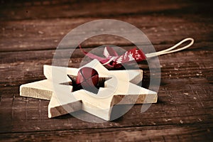 Wooden christmas star on a rustic wooden surface